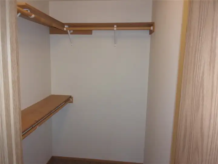 Walk-in closet in primary bedroom.