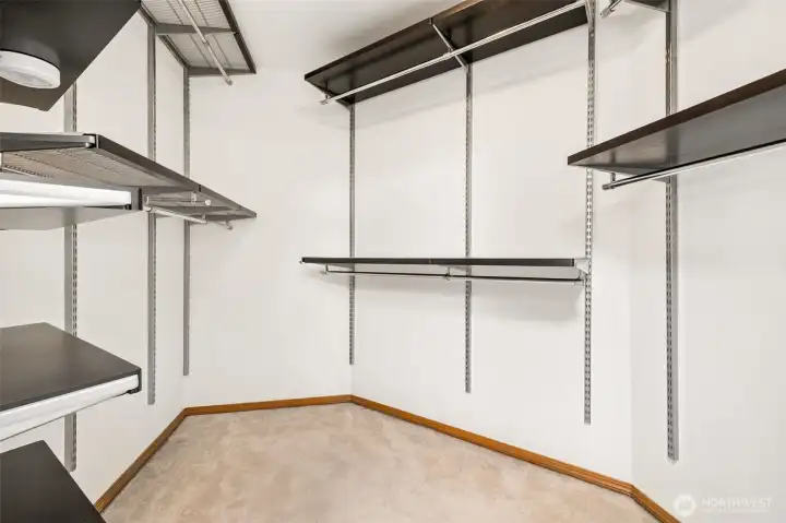 Primary suite large walk-in closet with built-in shelving!