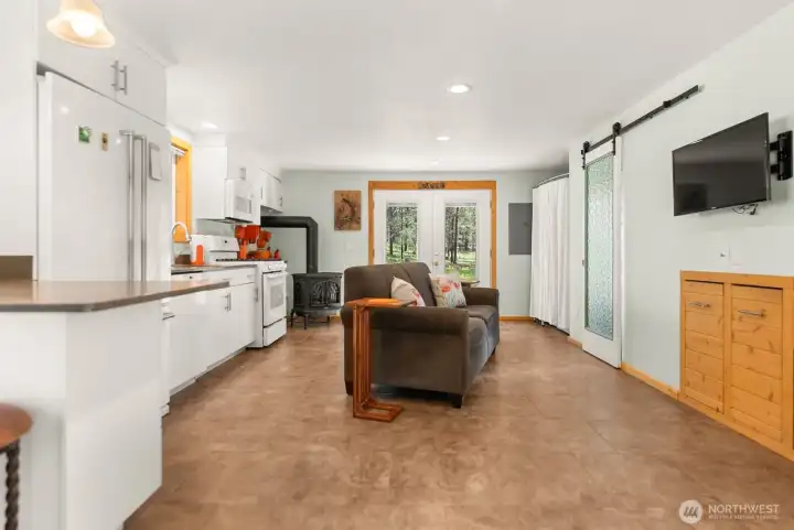 Well-appointed kitchen with eat-in area. Freestanding stove warms you all Winter.
