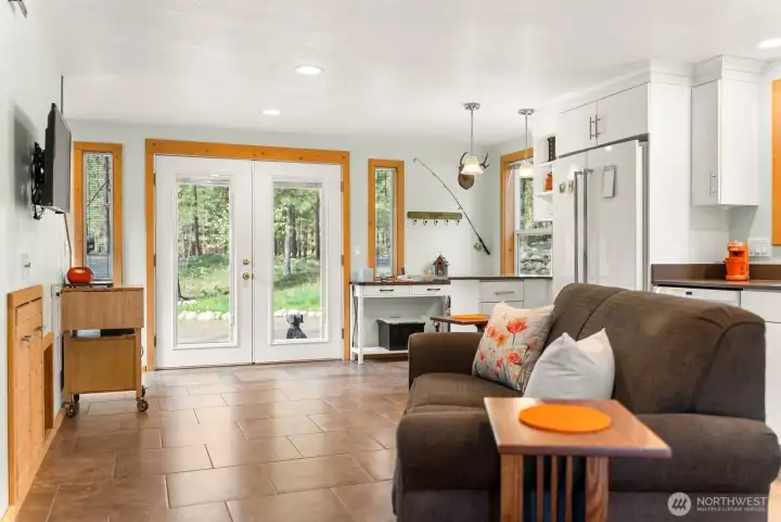 French doors entry off covered wood deck opens to main level of this great       French doors open into this turnkey property in immaculate condition. Sparkling clean ceramic tile floor. Like-new Kitchen and appliances.