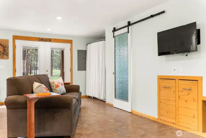 Lots of natural light and views from the front and back french-doors. Ceramic tile floor, 1/2 bath. Washer/Dryer room, full Kitchen.