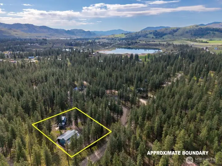 15 Barnaby Road in Twin Lakes Area nearby to Winthrop. Lightly treed 1 Acre. Meticulously landscaped.