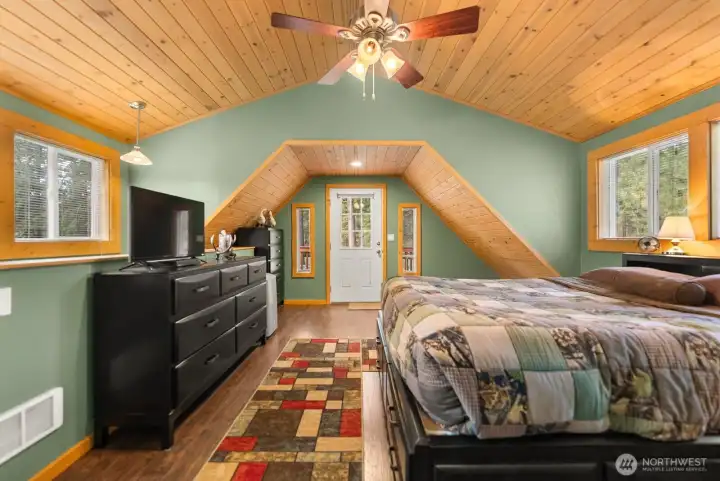 Spacious primary enjoys natural light from North and South windows. Wood vinyl floors are low maintenance and  pet friendly. Dog cubby on upper level.