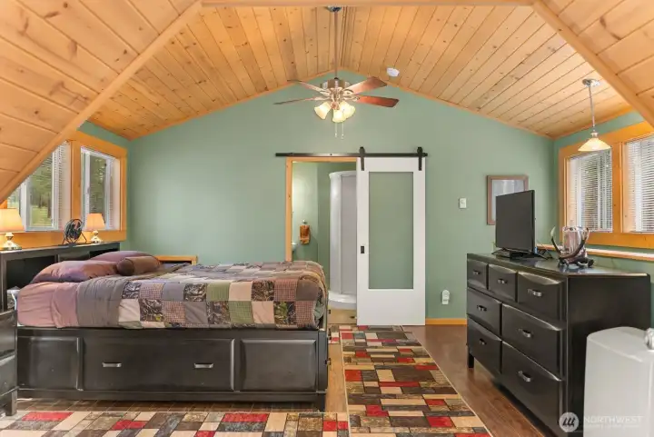 Primary bedroom for your own lodge like sleep and decompress.