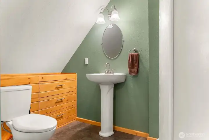 Primary bedroom ensuite bath has built in storage.
