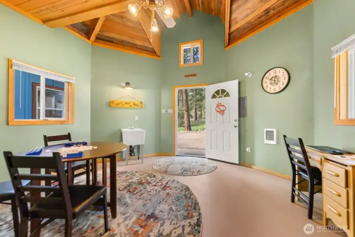 Outbuilding is 200 sf with slab-on-grade floor. Heated. Great Flex space.