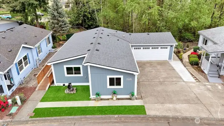 The two car attached garage has a new door, and there is plenty of off street parking, very nice.