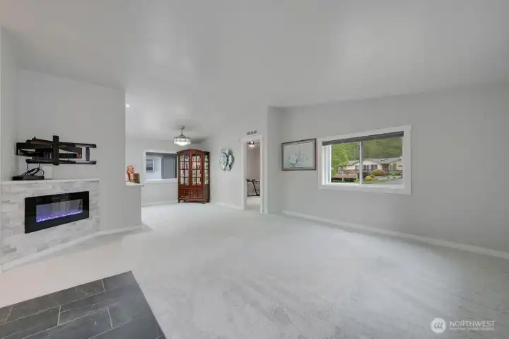 Entering the home you are greeted by a beautiful electric fireplace, fresh paint and carpeting that is like walking on clouds.