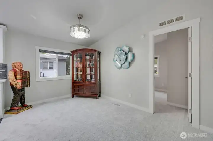 The dining room without staging. The door on the right goes to the third bedroom, it also makes a great office.