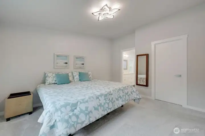 The door on the left goes into the beautiful primary bath, door on the right goes into the large walk-in closet.
