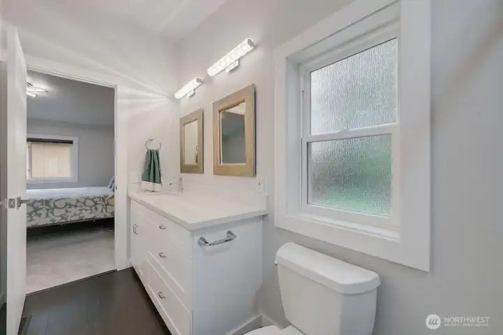 The large vanity provides ample storage; there is also an additional linen closet not shown.