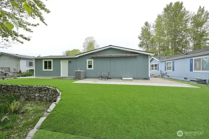 The back yard is all done in artificial turf, never mow grass again.