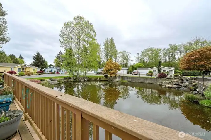 The view of the pond from the spacious deck, your new home is right across the street. Come see the beautiful home and wonderful community, you will love it.