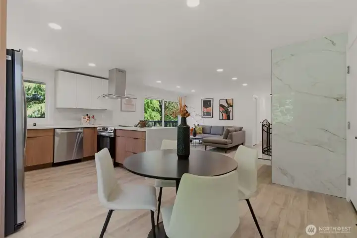 Dinning room area adjacent to a tiled Fireplace
