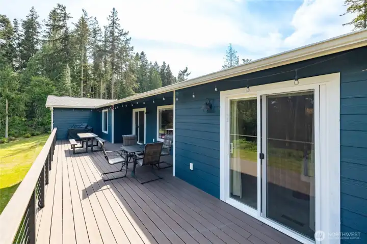 AWESOME Trex deck spans the length of the house in the back