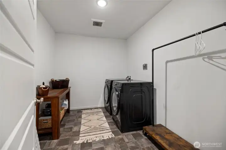 Laundry with plenty of space for cabinets