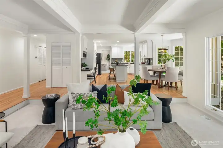 Stunning crown molding and wainscoting elevate the spaces.