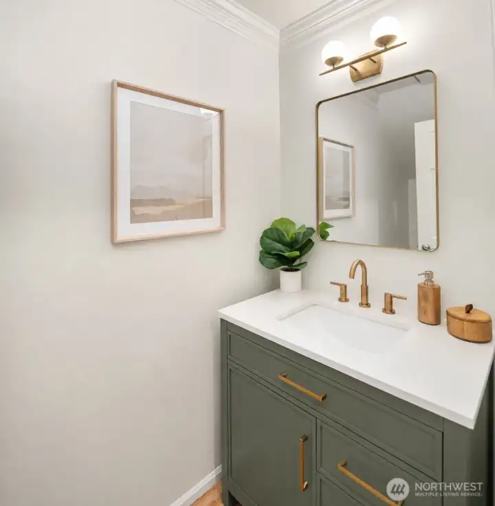 New powder room vanity with quartz countertop.