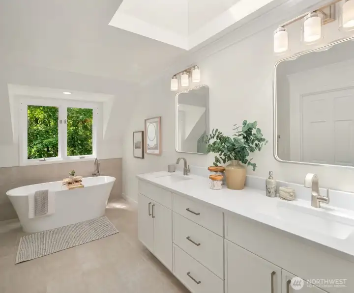 Luxury hotel style bathroom with backlit mirrors and new oversized vanity with quartz countertops.