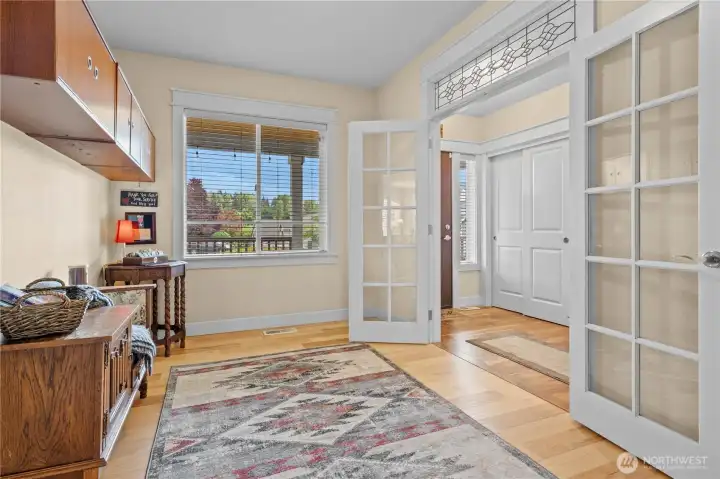 Den located off Entry, overlooking the front porch. Double French Doors, Hardwood Floors and Gorgeous Transom Window.