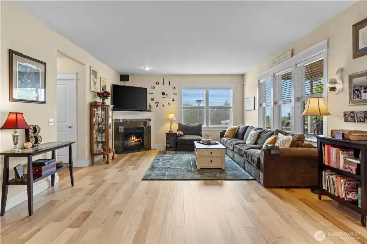 Great Room Concept Main Floor Living with Hardwood Floors, Gas Fireplace and Tons of Windows to take in the views.