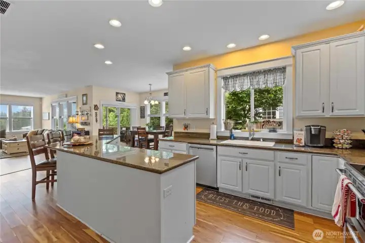 Updated Kitchen with Granite Counters, Hardwood Floors, Recessed Lighting and Stainless Steel Appliances.
