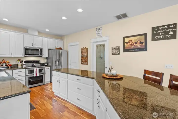 Amazing Curved Bar allows for several entertaining and cooking spaces. Breakfast Bar space, too!