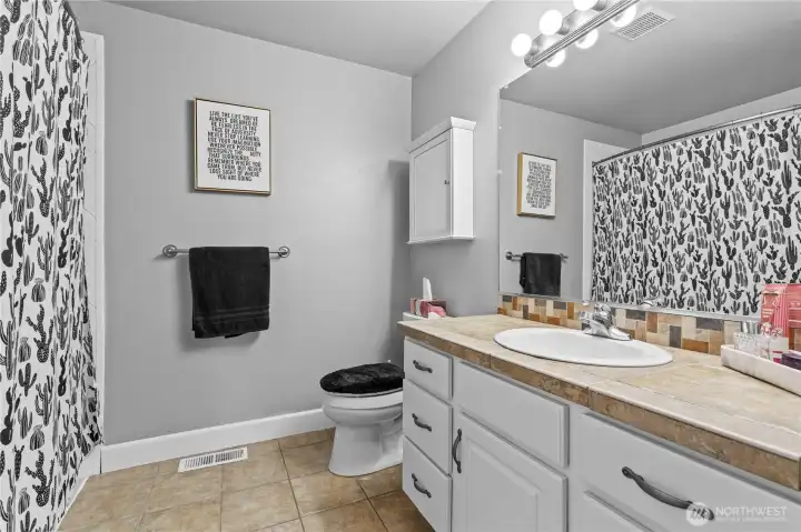 Hall Full Bath: Tile Floors, Tile Counters and updated Shower