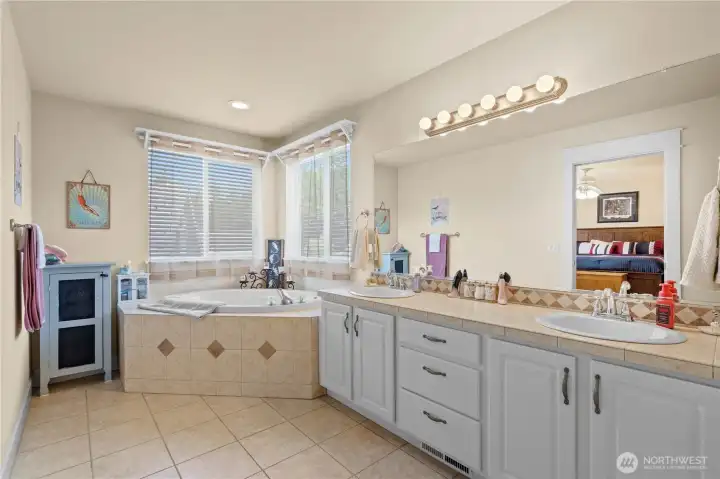 Primary Bath: Tile Floors and Tub Surround, Counters and Backsplash. Corner Windows for lots of light!