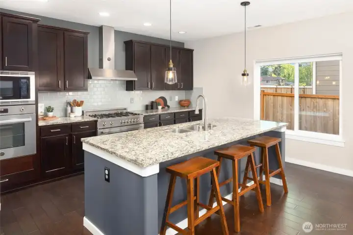 Beautiful eat-in kitchen, with stainless appliances, a large island and timeless design. Beautiful eat-in kitchen, with stainless appliances, a large island and timeless design.