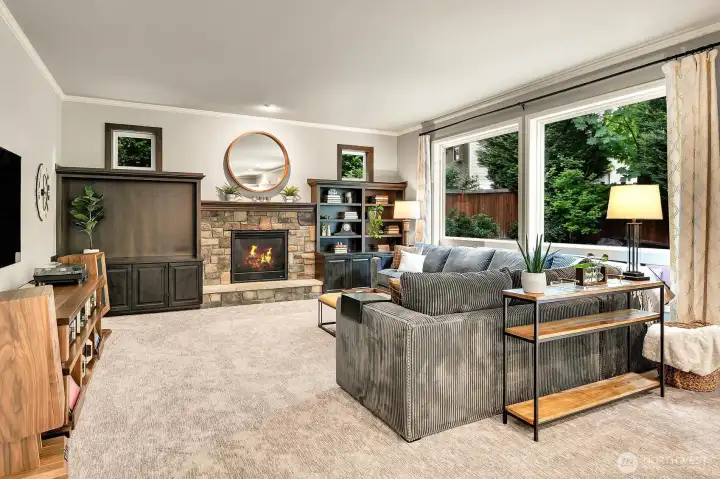 Family room with custom built-in cabinetry and gas fireplace Family room with custom built-in cabinetry and gas fireplace