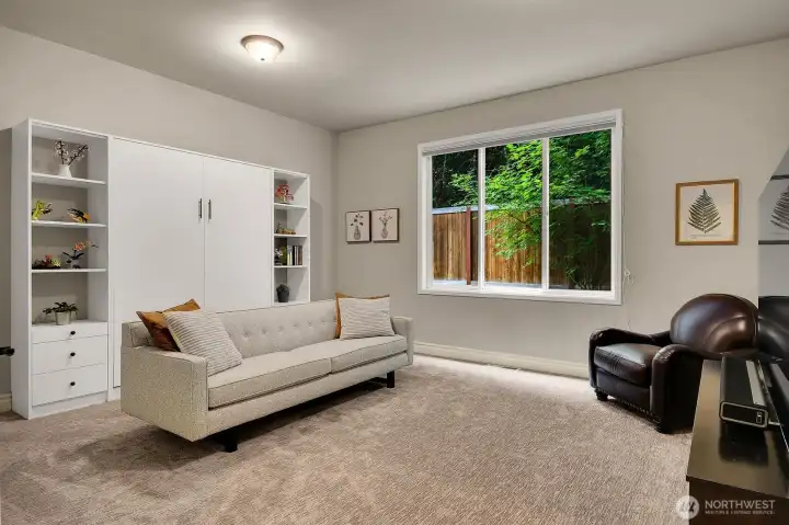 Main Floor guest suite/2nd family room features queen sized Murphy bed and adjacent full bath Main Floor guest suite/2nd family room features queen sized Murphy bed and adjacent full bath