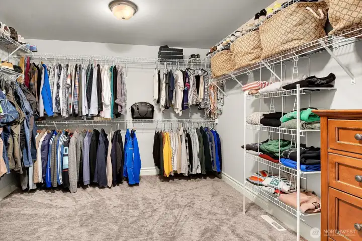 Primary walk-in closet Primary walk-in closet
