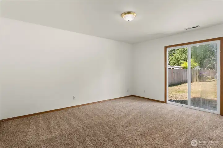 New Carpet, downstairs living space, sliding doors leading to backyard New Carpet, downstairs living space, sliding doors leading to backyard