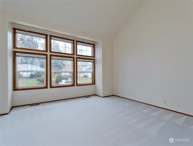 Large, wood wrapped windows fill the home with natural light.