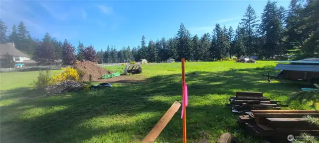 Stake in foreground is 330 feet from the street where property L shapes. Almost 2.5 acxres in back half. YOU WOULD OWN ALL THE WAY TO THE WHITE FENCE ON THE LEFT.