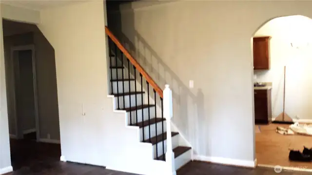 Interior Photo from 2014 Living room w stairs to now attic.