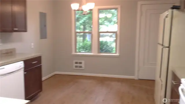 Interior Photo from 2014 Kitchen showing dining area next to front door.