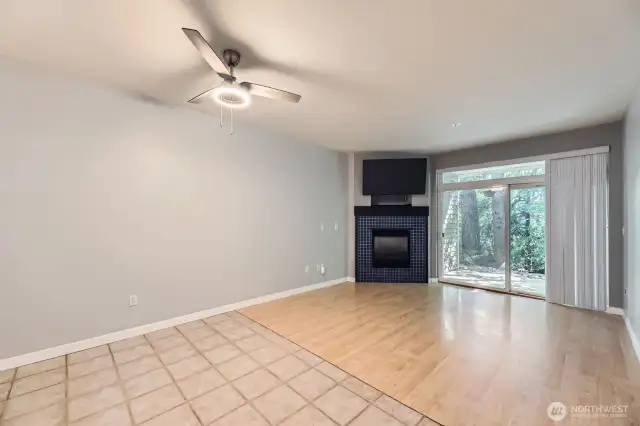Living room with gas fireplace & yard access door.