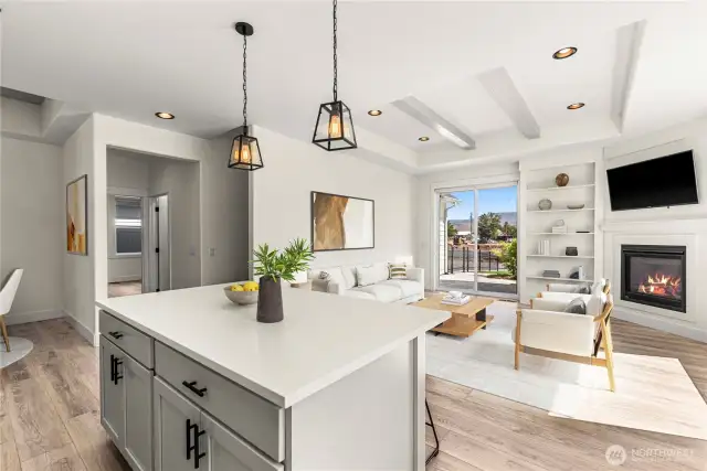 Great Room with built-ins, gas fireplace, and patio access. Lives Large