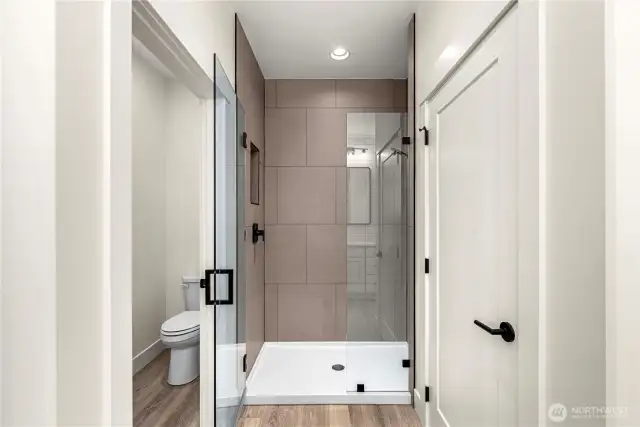 Spacious walk-in shower with tile surround
