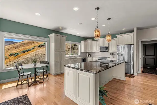Kitchen with breakfast noon, Large Island, Beautiful Bagdon Cabinets, Granite & Quartz Countertops.