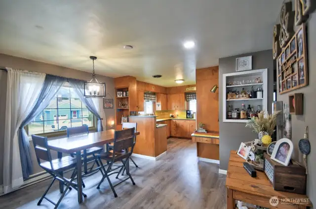 Dining area with lots of light and roomy kitchen.