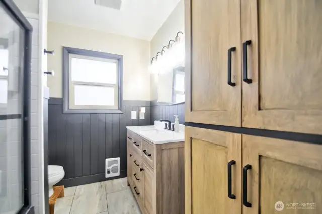 Ample storage in updated full bathroom.