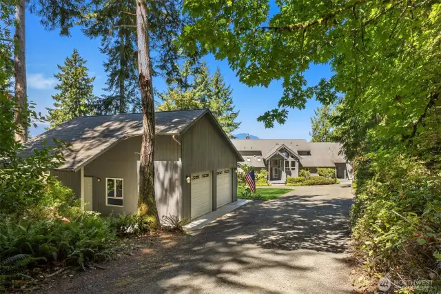 Huge detached garage with car/boat port.