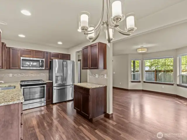 Great room, dining, & kitchen from slider