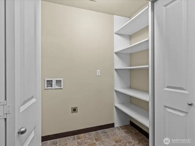 Laundry Closet on stair landing-where condos are attached