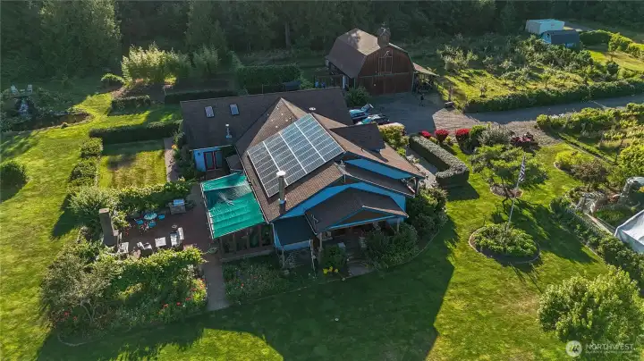 Lush gardens surrounding outdoor entertaining areas.