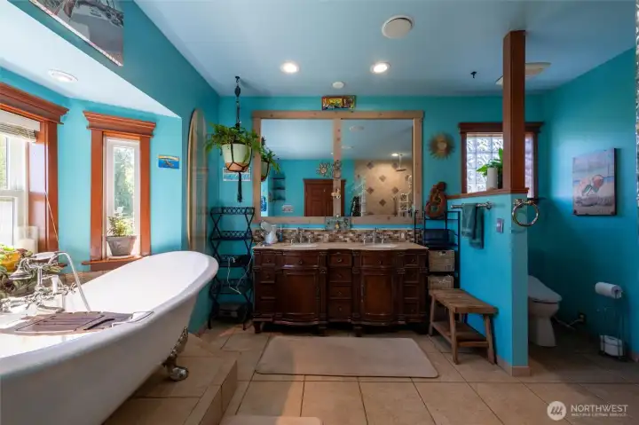 Luxurious bath retreat with soaking tub & timeless finishes.