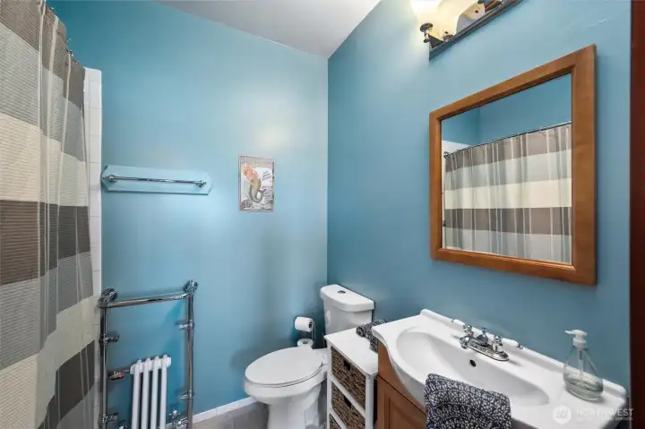 Bathroom featuring custom tilework & serene tones.